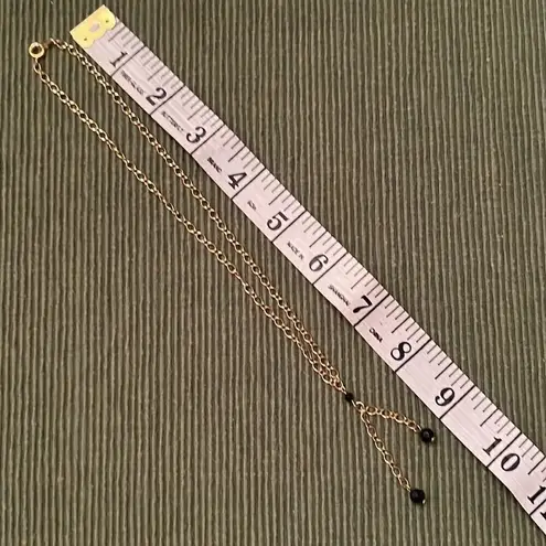 3 necklaces in black, black and gold, black and white colored EUC
