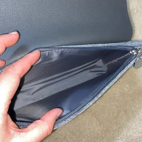 La Prarie clutch with brooch pin