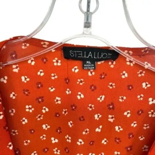 Stella Luce Floral Peplum Blouse