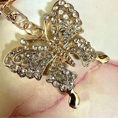 Gold tone butterfly rhinestone hang tag/keychain