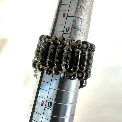 Grey flower ring with red rhinestone center Gray