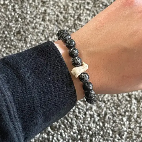 Black with white penguin charm beaded bracelet