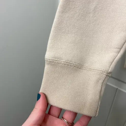 Hollister EUC ‎ Co women’s tan cream stitch decal pullover fleece lined hoodie M