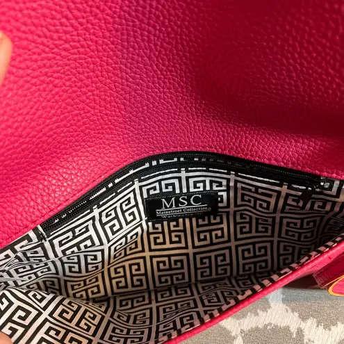 Pink Pebbled Clutch with Playful Tassel Pom Pom Trim