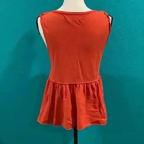 We The Free Free people  anytime peplum tank top in an orange color