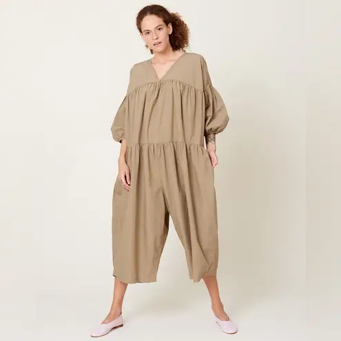 Black crane oversized puff jumpsuit in light clay color