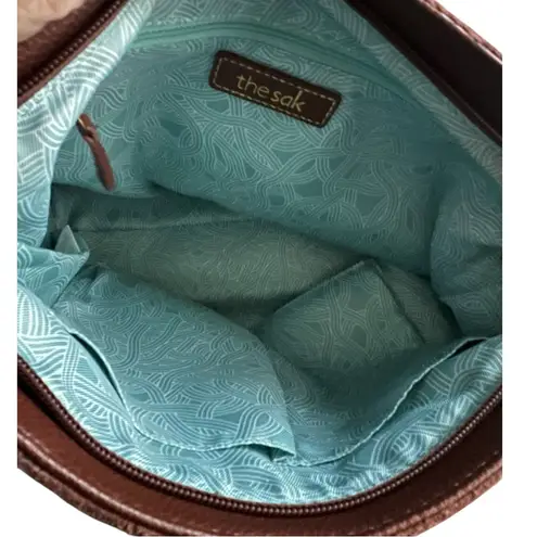 The Sak De Young Pebbled Leather Dangle Charms Shoulder Handbag.