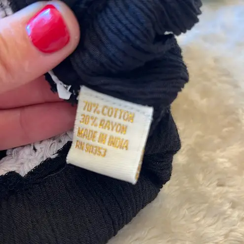 Rebellion Black and White Sleeveless Peplum Camisole