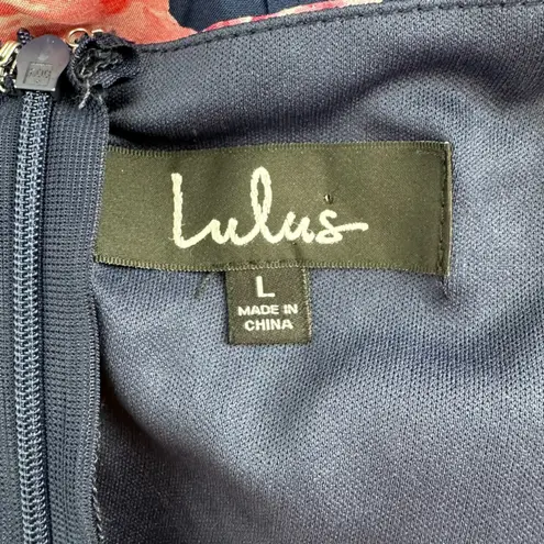 Lulu’s In the Garden Navy Blue Floral Print Romper size Large Apron Neckline