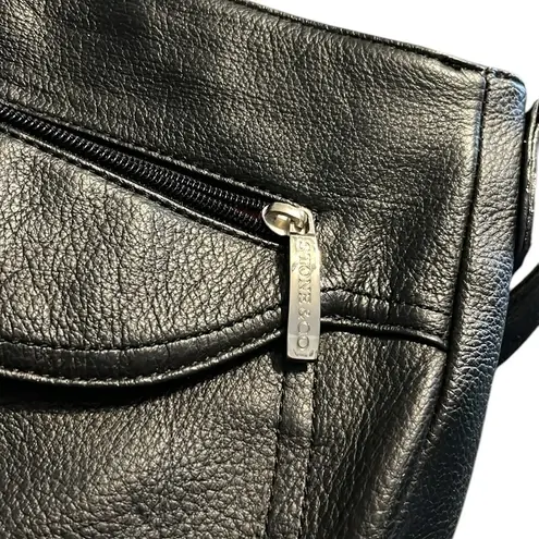 Stone & Co black leather shoulder bag with red and pink interior.