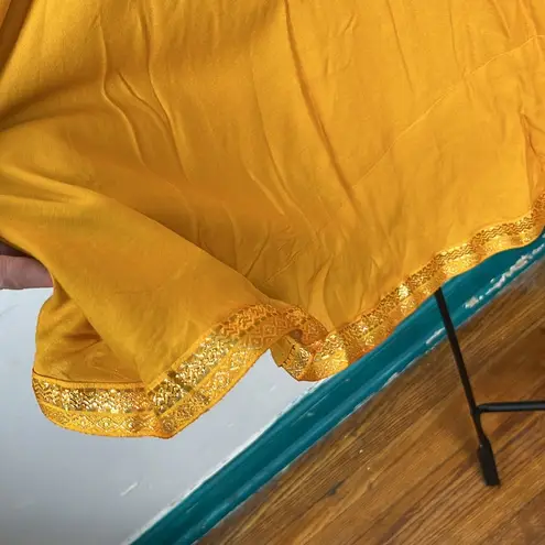 Gold wrap, maxi skirt, beautiful tassel tie, and trim on bottom Size undefined