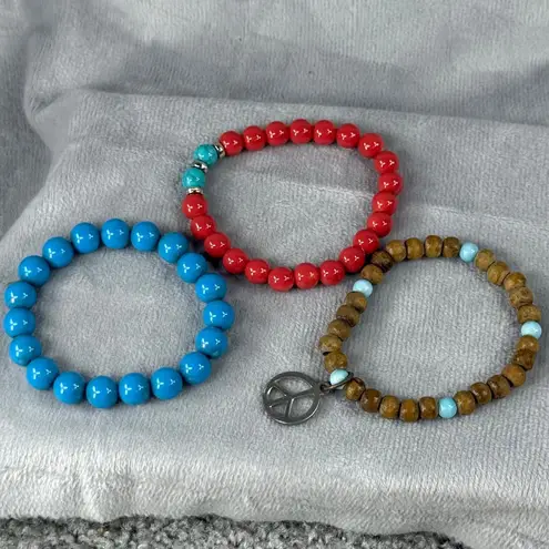 Set Of 3 Beaded Stretch Bracelets Red Blue & Natural Wood Beads Peace Sign Charm