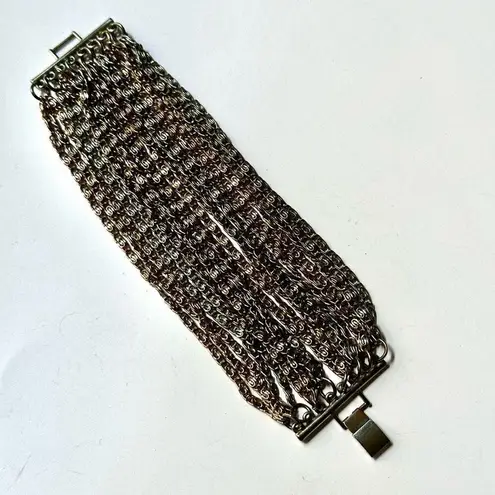 Gold and silver tone multi strand chain bracelet