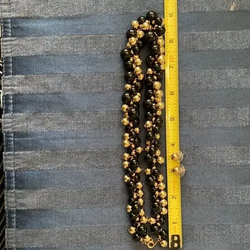 Stylish gold andĀ black beadedānecklaceāw/āmatchingāgoldāstudāearrings