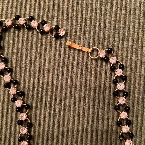 3 necklaces in black, black and gold, black and white colored EUC