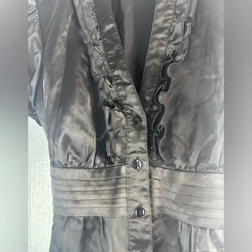 A Byer Buyer of CA Byline M Satin Ruffled Cap Sleeve Tie Back Blouse in Black