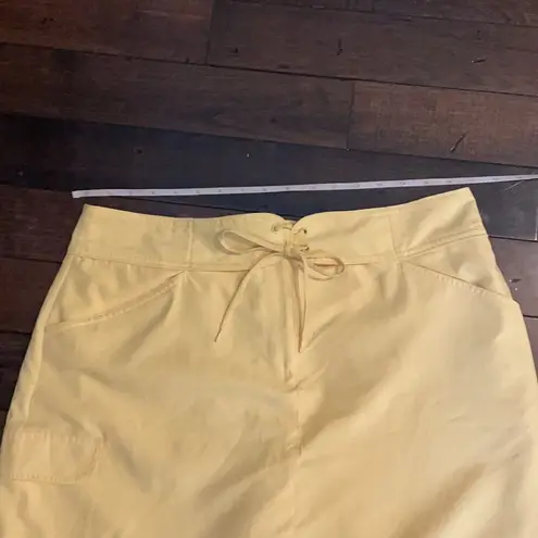 IZOD  golf skirt with inner shorts, yellow. Women’s size 12