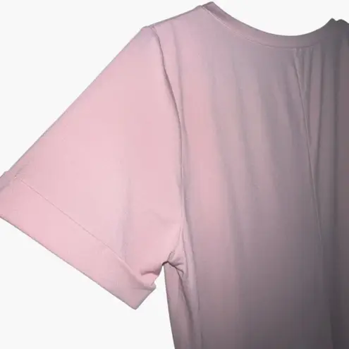 Halara NWT Pink Jumpsuit size S open, no waist def. Pockets. Pant side slit