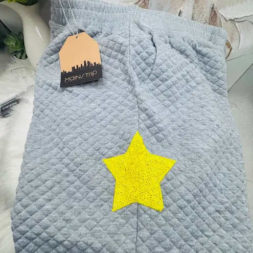 Main Strip WOMEN'S ELASTIC WAIST FRONT POCKET SEQUINS STARS DETAILED SWEATPANTS Medium