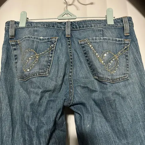 Bebe  women’s denim blue jean flare bottoms , rhinestones on back pockets