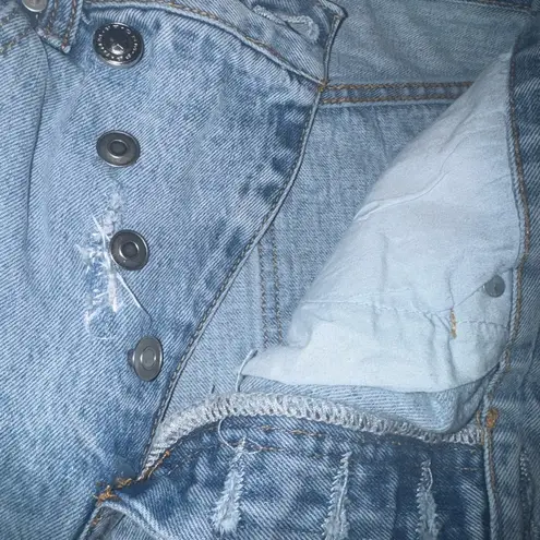 Princess Polly  HOLLY Highrise ASYMMETRIC RIPPED LEG JEANS LIGHT WASH DENIM