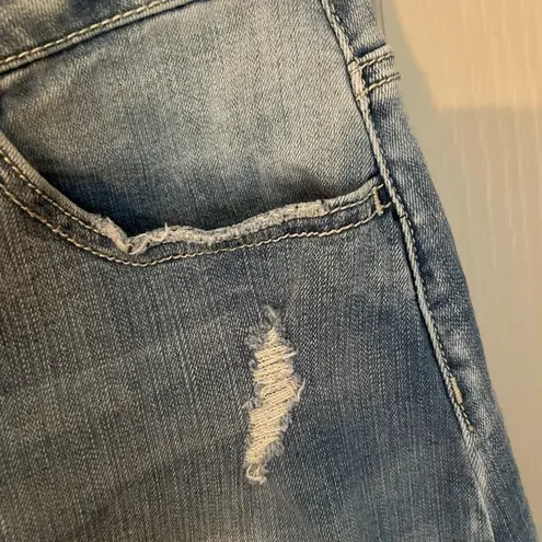 Indigo Rein  medium/light was distressed button front denim mini skirt.