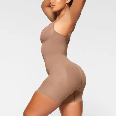 SKIMS Seamless Sculpt Mid Thigh Bodysuit in Sienna