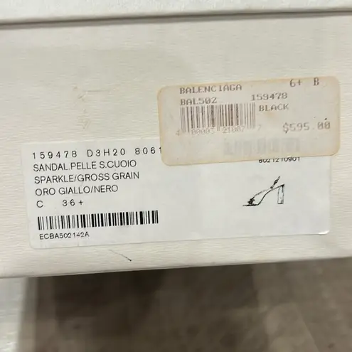 Balenciaga women’s gently used black and gold strappy sandals