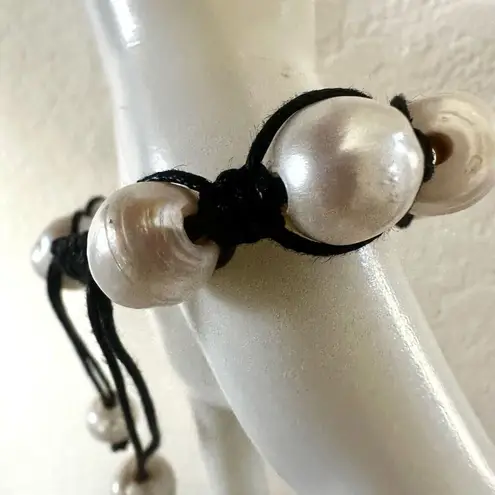 Pearl bracelet on adjustable black silk cord
