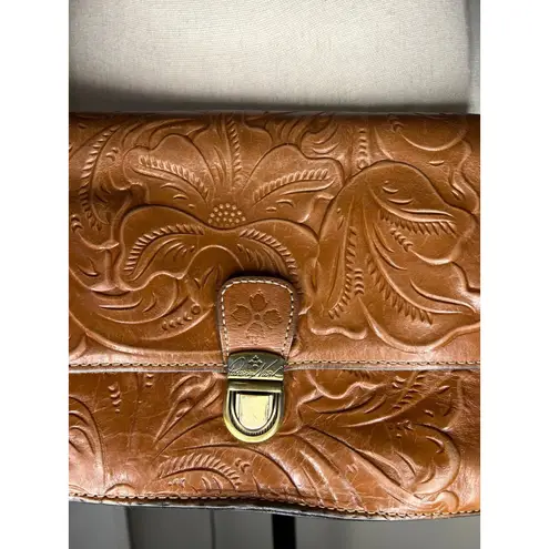 Patricia Nash Laurentina Tooled Leather Crossbody bag in a brown/tan color.
