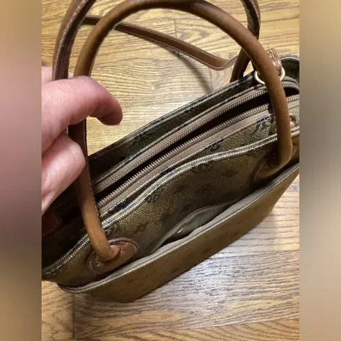 Rosetti purse. Dark taupe with brown leather handles and strap. Super cute