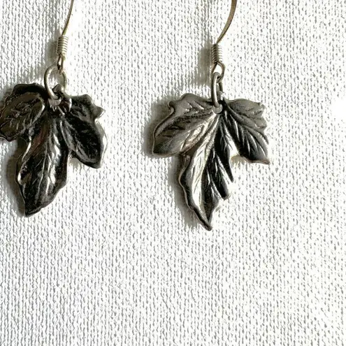 Silver tone maple leaf earrings