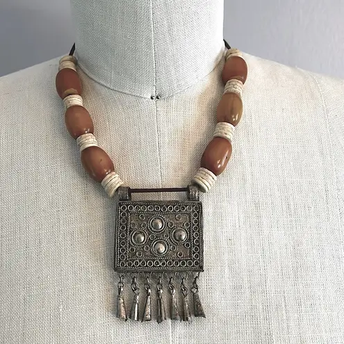 Handmade Vintage authentic African tribal necklace with metal center amber colored beads