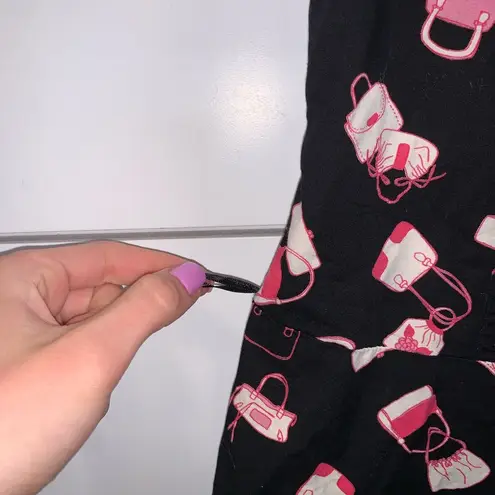 Divided Vintage style black dress with purses all over