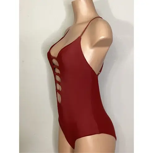 Becca New. knotted one piece. Size medium. Retails $129