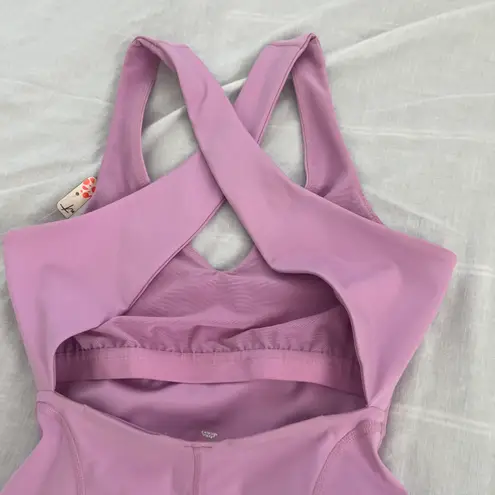 Free People Movement Here On Out Strappy Onesie Romper   Size XS  Condition: NWT  Color: bright orchid   Details : - See photo for approx. inseam measurement laying flat  - Built-in bra - not padded - Side pockets.