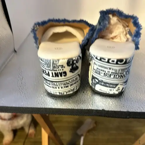 Wish denim sandals. With the skull and cross embroidery black on them. Size. 11