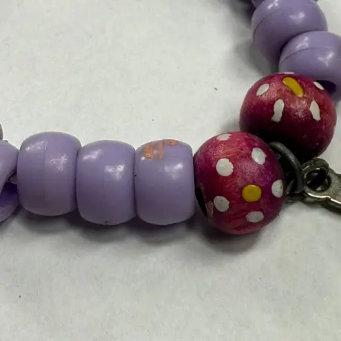 Assorted Stretch Bracelets 3 Piece Shades of Purple Dangle Charms Cross Crown