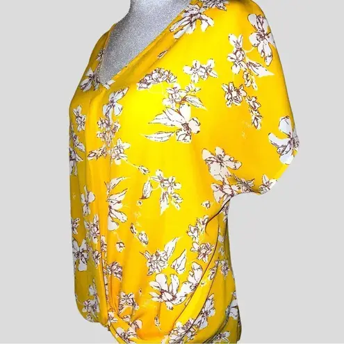 West Kei  pretty dark yellow twisted hem blouse with floral design! New