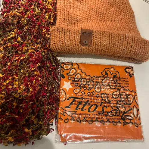 Beautiful bundle of ladies cozy accessories in autumn earth tones scarves hat Orange