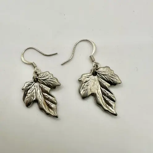 Silver tone maple leaf earrings