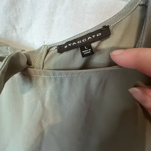 Staccato green blouse with tie back closure. Size large