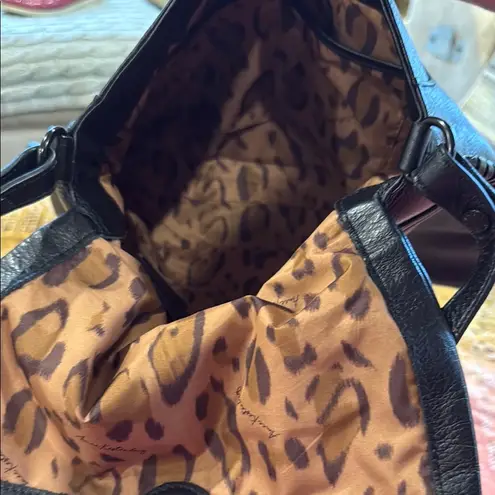 Aimee Kestenberg Black Crossbody Bag with Adjustable Strap and Flap Closure