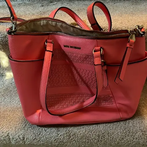 Dana Buchman pink leather purse with handles and shoulder strap. Pockets inside