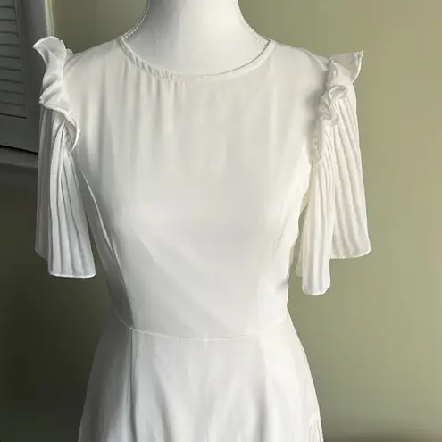 Here Comes the Sun  white ruffle sleeves open back mini dress