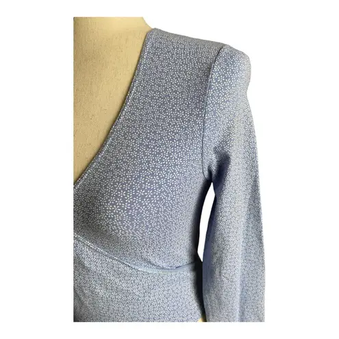 Brandy Melville Beautiful blue with tiny white flowers wrap top, long sleeves, has stretch, excellent condition, size medium Measurements: Bust: armpit to armpit 16 inches  Length: shoulder seam to bottom 17 inches