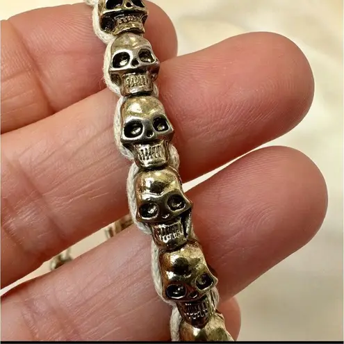 Gold tone skull cord adjustable bracelet