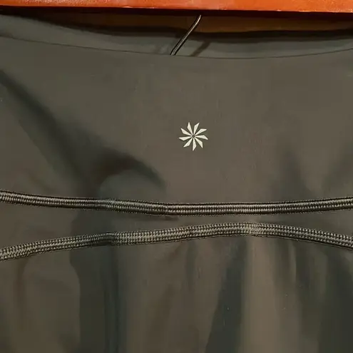 Athleta  Ace Black Tennis Skort with silver reflective stripe on waistband