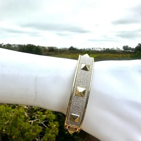 Silver and gold tone sparkly bangle hinged bracelet