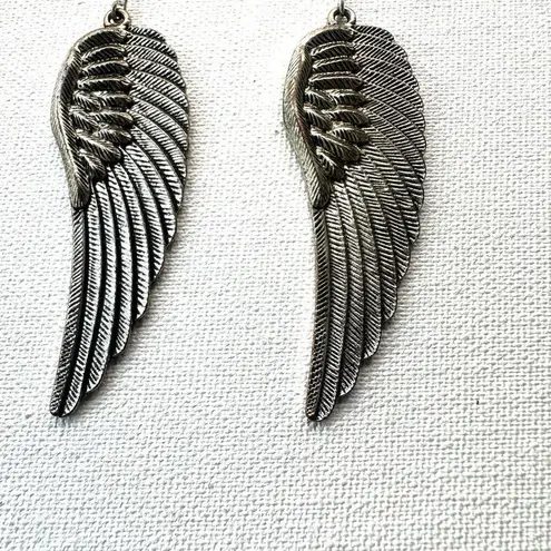 Silver tone angel wing earrings